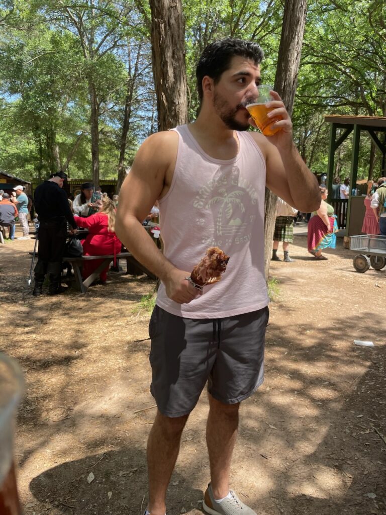 Michael Angelo SMP Artist Angelo, enjoying a beer and turkey leg at the Sherwood Forest Faire Renaissance Fair in Austin Texas.